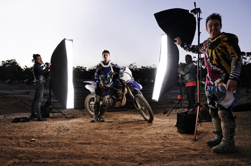 Photoshoot, motorcycle and person in nature with lighting, equipment and tools for creative...