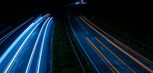 lights of cars driving at night. long exposure