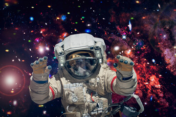 Astronaut surfing dark space with stars. The elements of this image furnished by NASA. - 743686595