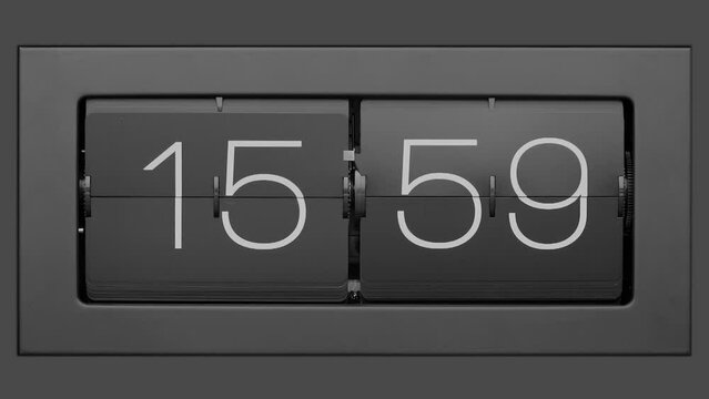 Flip clock quickly flips. Retro flip clock changing from 15:59 to 16:00. Slow motion.  