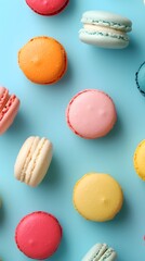 Macarons arranged on colorful pastel background
