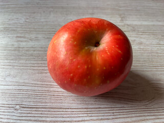 red apples on wooden table