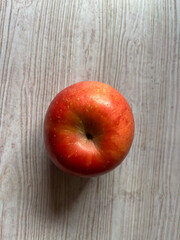 red apples on wooden table