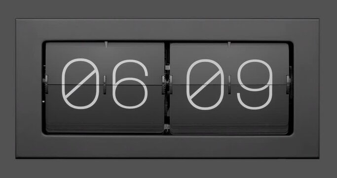 Flip clock quickly flips. Retro flip clock changing from 05:59 to 08:00. Time lapse. 