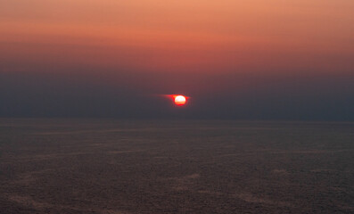 Aerial drone photo of Ile Rousse with a magnificent sunset over the sea in Corsica