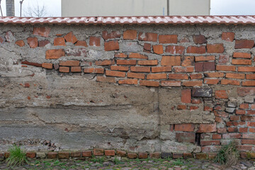 Brickwall with red, brown and black bricks