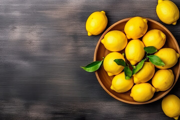 Short food supply chains SFSCs.From garden to plate concept.A bowl of fresh lemons on the wood table.Flat lay,Copy space