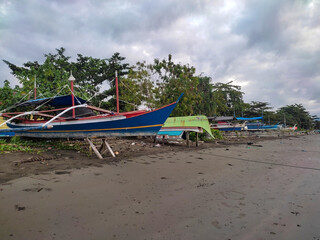 The traditional fishing boats of East Halmahera fishermen parked by the shore near their settlement.