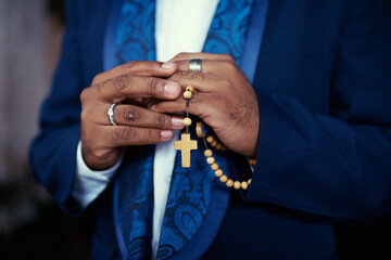 Hands, prayer with beads and Christian man in worship for religion, trust and spiritual hope with...