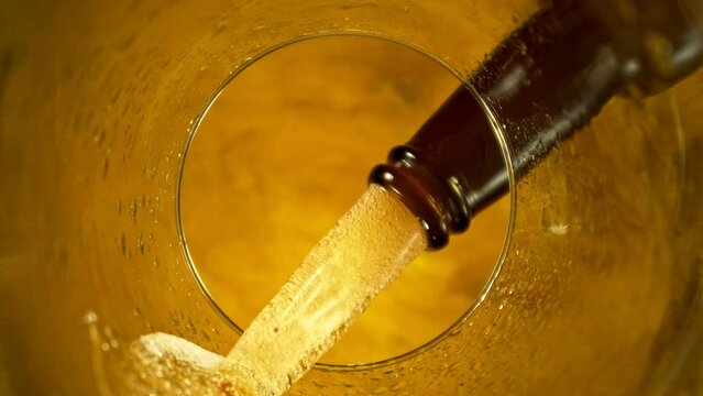 Super Slow Motion of Macro Shot of Pouring Beer drink. Unique Perspective from inside of a Glass. Filmed on High Speed Cinema Camera, 1000 fps.