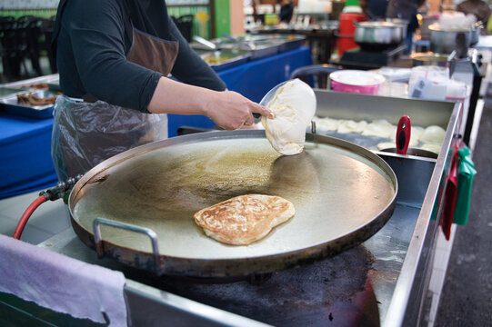 Making Roti Canai at a Malaysian Street Market