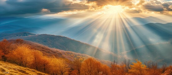 The painting depicts a stunning autumn morning scene atop mountains, with dramatic cloudy skies and sun rays breaking through the clouds.