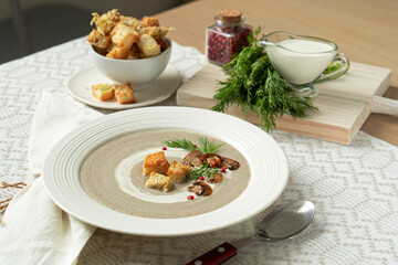 Cream soup of vegetables and champignons with croutons