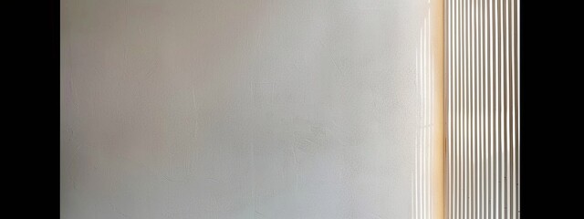 An interior light gray wall minimalist
