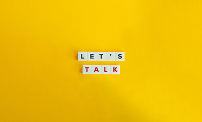 Let’s Talk Phrase and Text on Block Letter Tiles. Concept of Having a Conversation, Chat,...