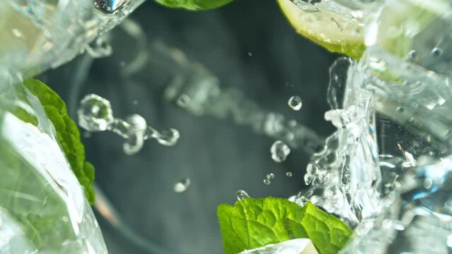 Super Slow Motion of Macro Shot of Pouring Mojito drink. Unique Perspective from inside of a Glass. Filmed on High Speed Cinema Camera, 1000 fps. Speed Ramp Effect.
