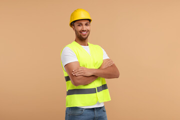 Engineer in hard hat on beige background