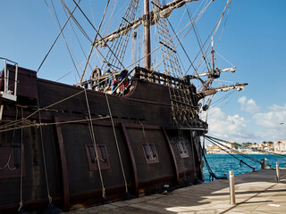 The anchored Spanish galleon captures the essence of maritime history and port life. - 743767330