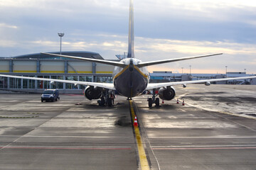 Airplane parked at airport tarmac, jet airliner, travel, transportation - 743767360