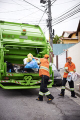 Garbage truck, dirt and team with collection service on street in city for public environment...