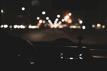 Night road. View from inside car. Natural light. Street and other cars is motion blurred.