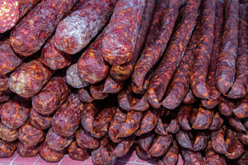 Serbian traditionally made and smoke dried sausages on a farmer's market in Kacarevo village,...