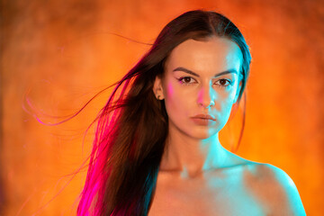 Portrait shot of a pretty young woman in RGB colors.