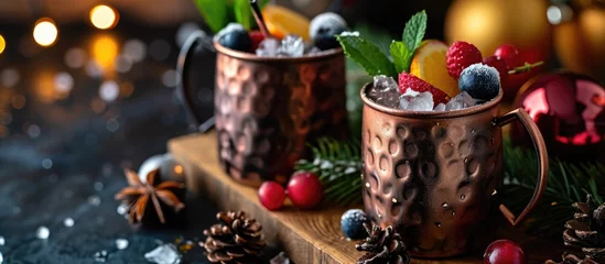 Tuinposter Festive Moscow mule with seasonal fruits in a charming space © Emin