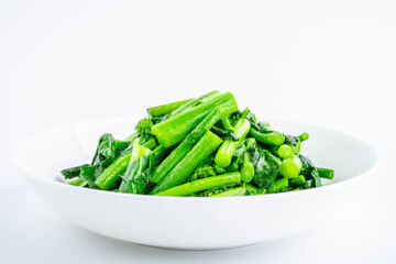 A plate of fried rapeseed greens