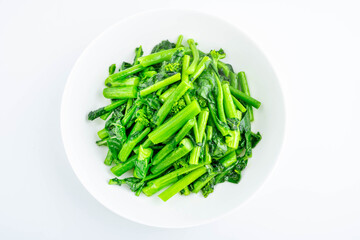 A plate of fried rapeseed greens