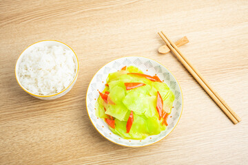 Diet meal for one person with rice and fried lettuce