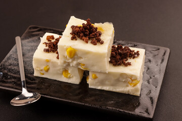 Maja Blanca is a Filipino Dessert Made of Coconut Milk and Corn, Thickened with Cornstarch. Filipino Coconut Milk Corn Pudding.