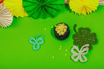 Handmade St. Patrick's Day concept. Traditional decorative symbols, pot with golden coins