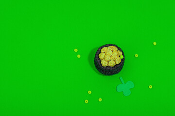 Handmade St. Patrick's Day concept. Traditional decorative symbols, pot with golden coins