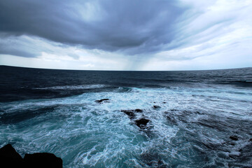 Fototapeta premium Atlantic ocean with blue waves in stormy day. Beautiful nature landscape photography. Deep sea water waves and stormy sky. Sea Background. Wallpaper. Panoramic view.