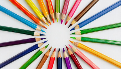Fototapeta premium Colourful array of art pencils in creative rainbow spectrum, learning and education concept