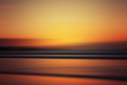 Sunset colors on ocean horizon, motion blur. Abstract background that looks like sunset sky and sea at the sunset