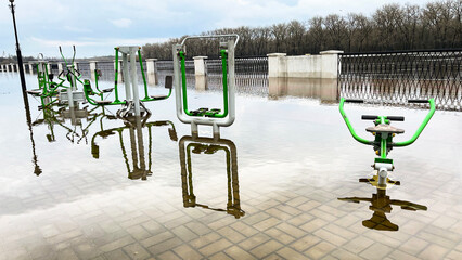 Spring floods that flooded the paths on the river embankment and sports equipment.