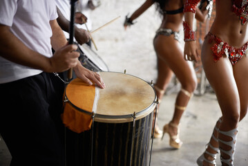 Drummer, playing and music with percussion by stage, dancers and rhythm of artist with talent in...
