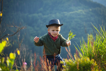 Cute Little Boy with Hat and Bandana in Beautiful Mountains - 743835301