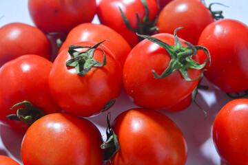 Tomato isolated. Tomato whole, half, on white background. Tomatoes with green basil leaves. Clipping path. Full depth of field.