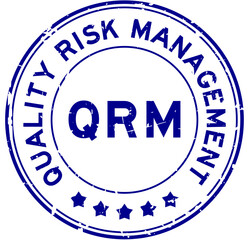 Grunge blue QRM Quality Risk Management word round rubber seal stamp on white background