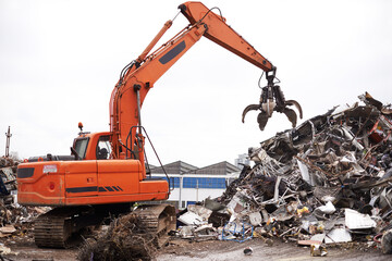 Crane, vehicle and junkyard to recycle metal with sustainability, manufacturing and stop pollution....