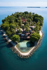 Obraz premium This photo captures the serene beauty of a solitary island surrounded by the vast expanse of the ocean. The island appears lush with greenery, contrasting against the endless blue waters