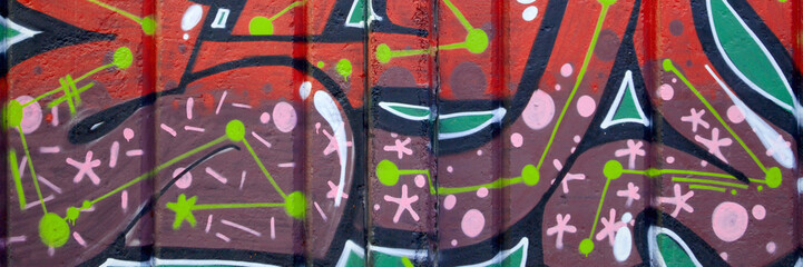 Colorful background of graffiti painting artwork with bright aerosol outlines on wall. Old school...