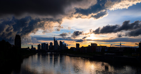 Frankfurt Germany colorful sunset skyline panorama with tall downtown office buildings bridge and...
