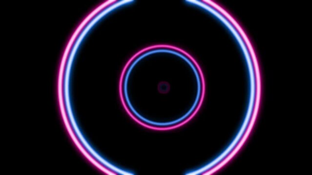 A vibrant purple neon circle emits a magenta glow in the dark, set against an electric blue background. The visual effect lighting creates a mesmerizing pattern in this artistic display