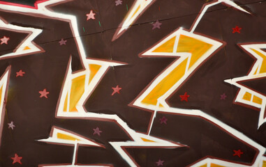 Colorful background of graffiti painting artwork with bright aerosol outlines on wall. Old school...