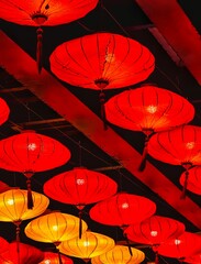 red and yellow lanterns hanging on ceiling for traditional lantern festival chinese new year decoration © Steven