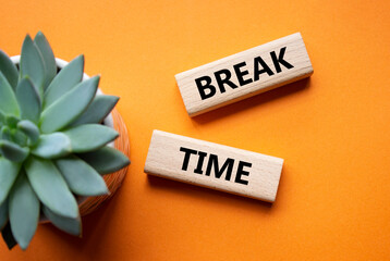 Break Time symbol. Concept word Break Time on wooden blocks. Beautiful orange background with...